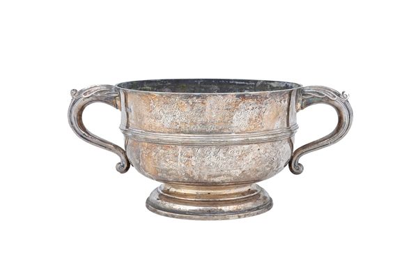 A silver twin handled trophy bowl, with bold scrolling handles, raised on a circular foot, presentation inscribed, diameter 20.5cm, London 1922, weigh