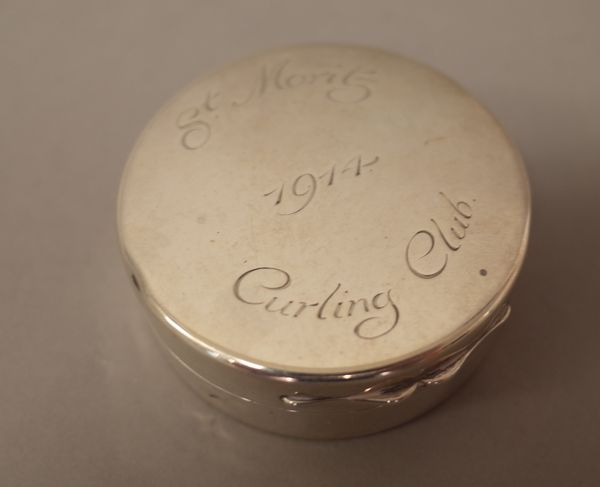 An Asprey, London circular silver cased travelling hinge lidded aneroid barometer cum thermometer, the cover engraved St Moritz 1914 Curling Club, dia