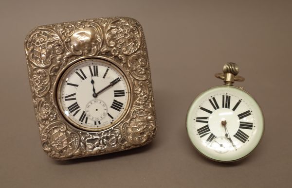 A silver fronted rectangular Goliath watch case, with embossed decoration, with a base metal cased keyless wind, openfaced Goliath watch, the movement