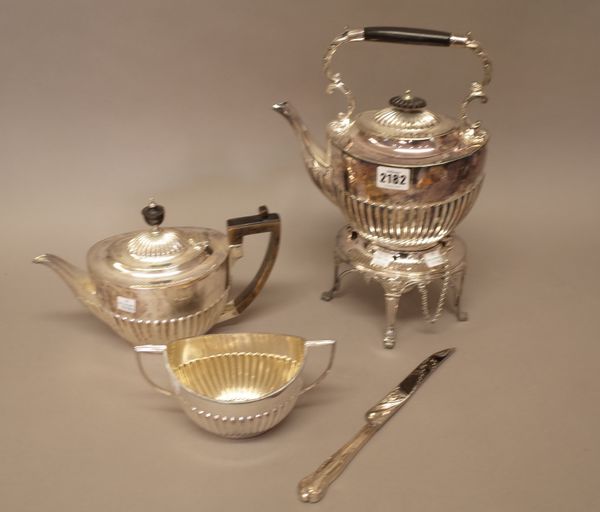 Plated wares, comprising; a sprirt kettle with a stand and a sprirt burner, a teapot and a twin handled sugar bowl, each piece of oval form with partl