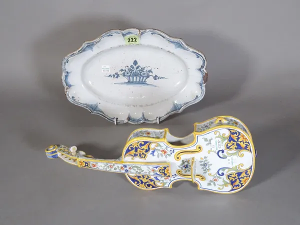 A late 18th century French faience oval blue and white dish and a 19th century French faience model of a violin  CAB