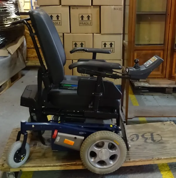 An electric wheelchair and accessories.   EXTRA