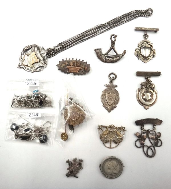 Two gold mounted brooches, a diamond and blue gem set stick pin and mostly silver jewellery, including six brooches, five fob medals, a neckchain, thr