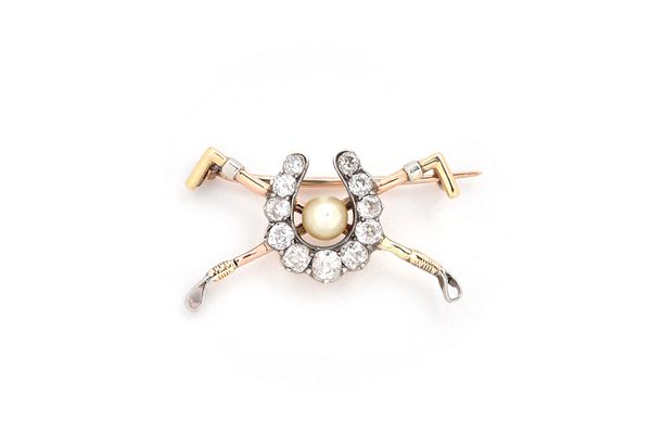 A gold and silver set diamond and cultured pearl brooch, the centre with a diamond set horseshoe motif, set with cushion shaped diamonds, centering a