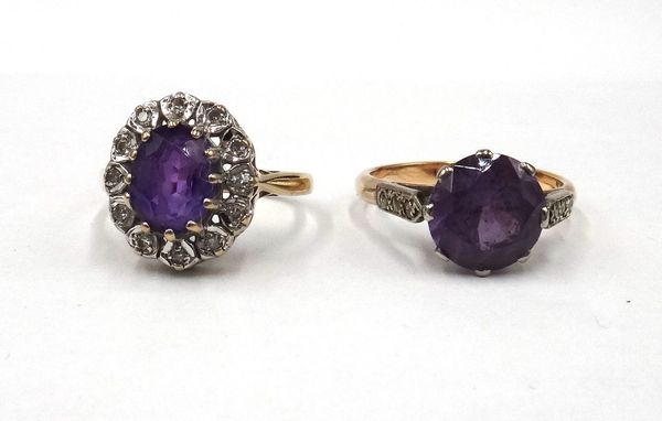 A 9ct gold, amethyst and diamond set oval cluster ring, claw set with the oval cut amethyst in a surround of circular cut diamonds, ring size N and a