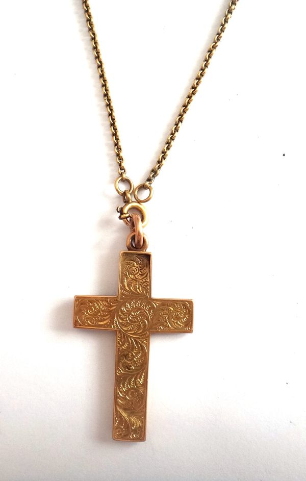 A Victorian gold pendant Latin cross, with engraved decoration, with a gold circular link long chain, combined gross weight 19.8 gms.