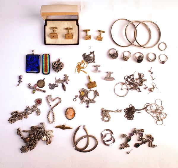 Silver and other jewellery, comprising; a charm bracelet, three further bracelets, three bangles, six rings, two pairs of cufflinks, odd cufflinks, te