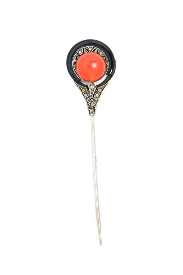 An Art Deco coral, black onyx and rose diamond set part of a jabot pin, mounted with a single coral bead to the centre and otherwise set with rose dia