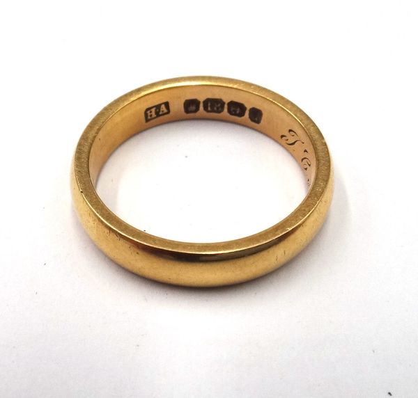 An 18ct gold wedding ring, engraved with initials and date within the band, Birmingham probably 1903, ring size O, weight 6.4 gms.