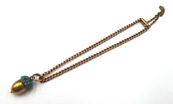 A gold curb link bracelet, fitted with a safety chain, on a snap clasp, detailed 15 CT and a gold and turquoise set small pendant, designed as an acor