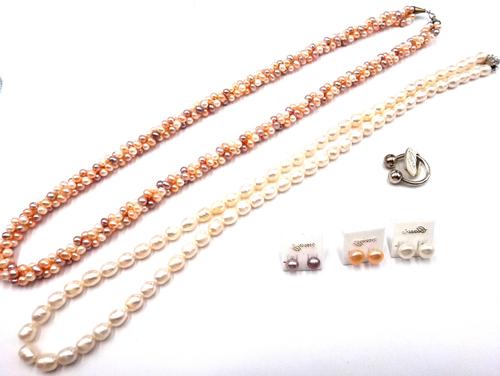 A three row ropetwist necklace of vary coloured freshwater cultured pearls, a single row necklace of freshwater cultured pearls, three pairs of freshw
