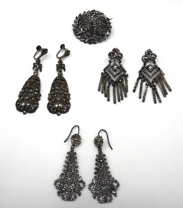 Two pairs of cut steel pendant earrings, the tops with wire fittings, a cut steel brooch, of circular wreath form, the centre with a butterfly motif,