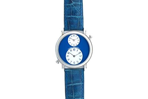 A Theo Fennell white gold, circular cased twin dial wristwatch, designed as a smaller dial above a larger dial, both having blue Arabic numerals on a