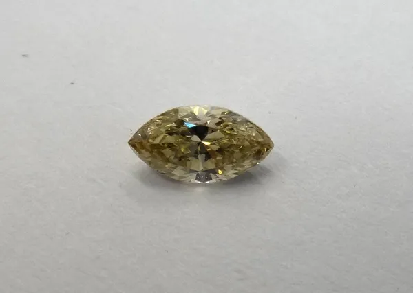 A marquise-cut loose diamond, 0.32ct., brownish yellow, I1.  This Lot is subject to VAT on the hammer.