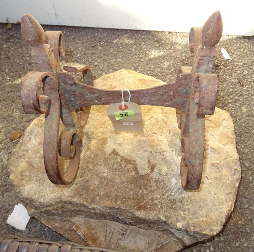 An early 19th century wrought iron boot scraper, on stone base, 45cm wide.  OUT