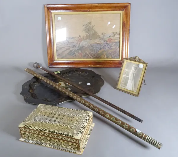 Collectables, comprising; a paper mache tray, a photograph in a small brass frame, a mother of pearl inlaid cigarette box, a walking cane with white m