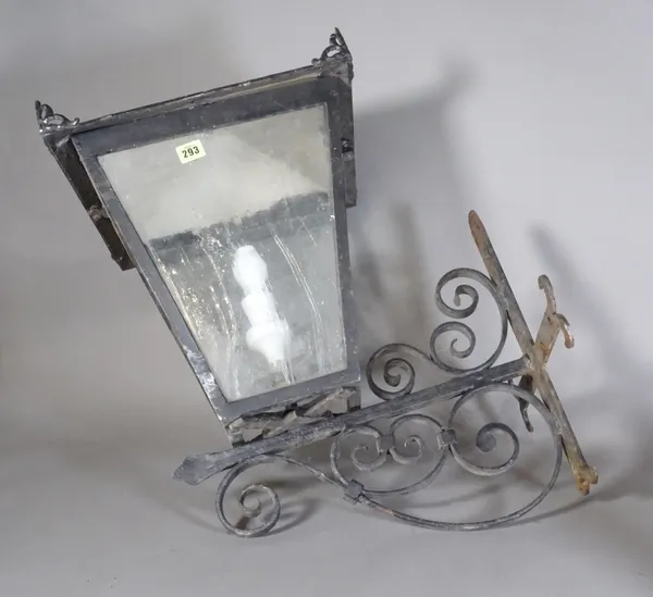 A 20th century wrought iron wall mounted street lantern of tapering form, 70cm high, (a.f).   S4M