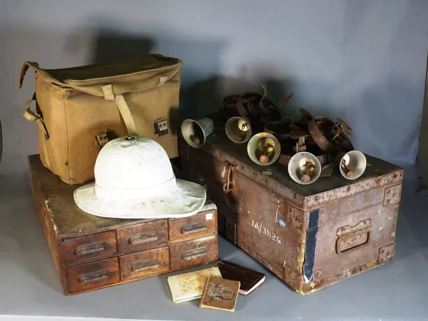 A group of six early 20th century servant bells, a pith helmet, a 19th century oak tool chest of six drawers 40cm x 16cm high and a 20th century metal