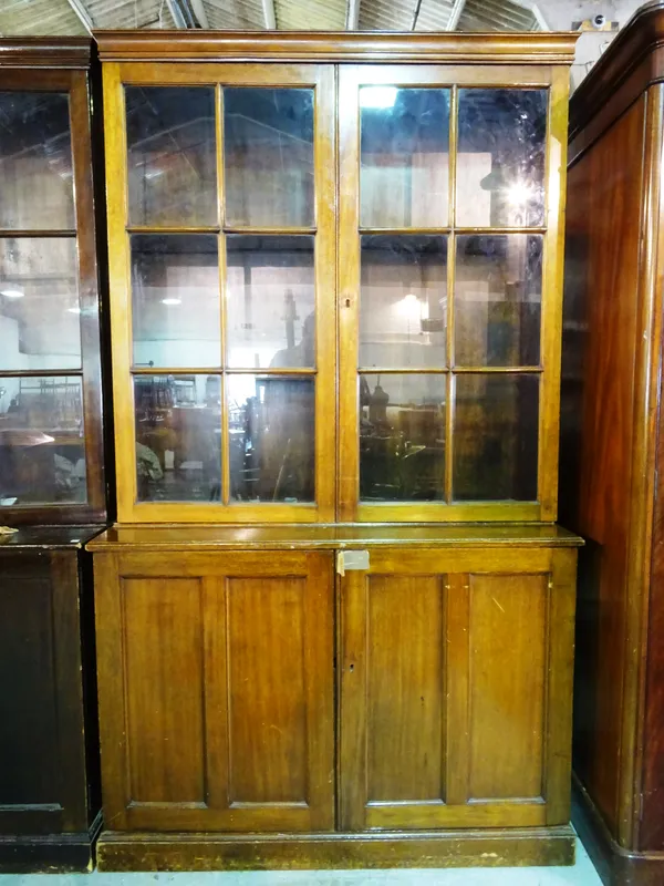 An early 20th century mahogany two door bookcase cabinet 125cm wide x 208cm high.  M6