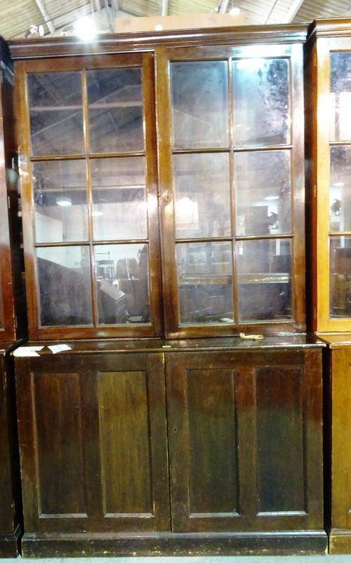 A pair of early 20th century mahogany two door bookcase cabinets, 125cm wide x 208cm high, (2).  M7