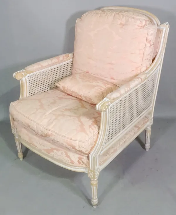 A set of three stained beech Louis XVI style bergere armchairs with pink upholstery, (3).  B4