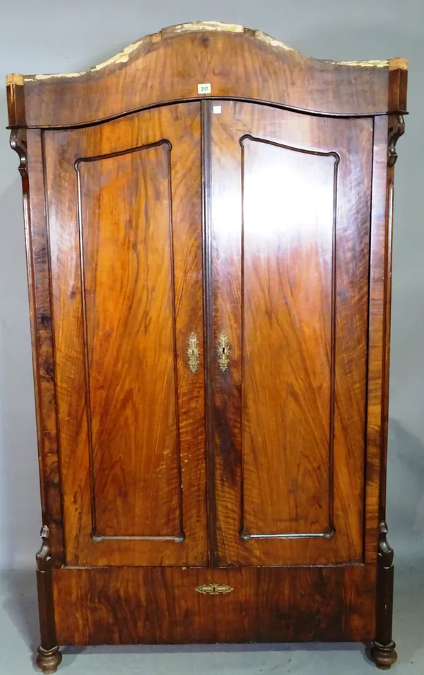 A late 19th century walnut Continental arch top two door armoire on bun feet, 102cm wide x 178cm high, (a.f).   M10