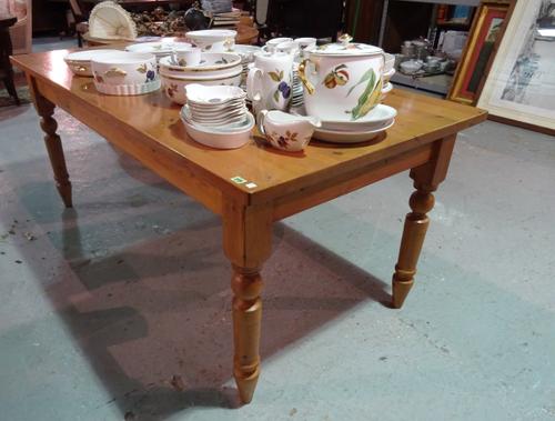 A 20th century pine rectangular dining table on turned supports, 183cm long x 91cm wide.  BAY 1