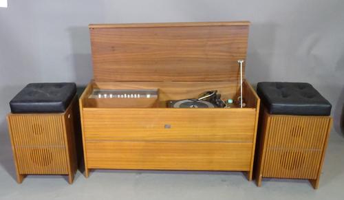 A 20th century teak cased Garrard record player and a pair of speakers/ stools with cushioned leather tops.   K8