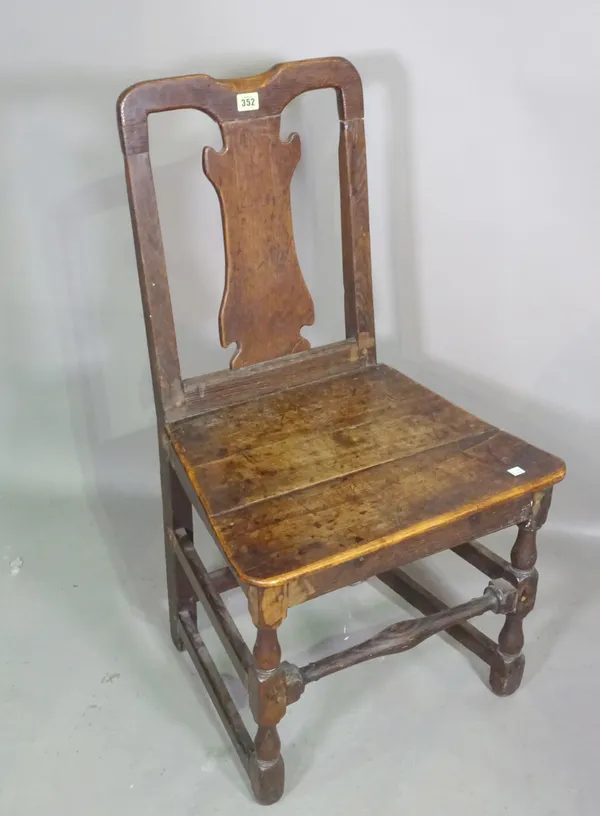 An 18th century oak cases back side chair on block and turned supports, 51cm wide x 90cm high.  I7