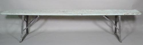 An early 20th century wooden and metal folding bench.  C9