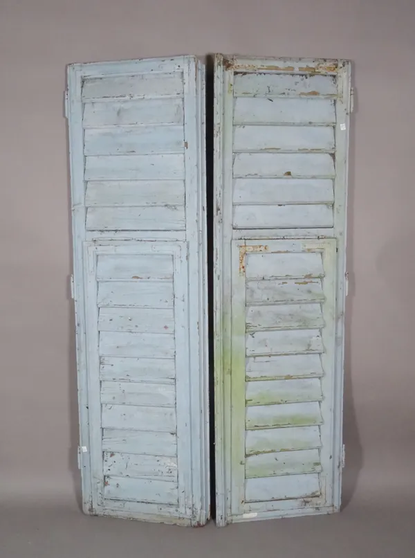A pair of early 20th century blue painted window shutters, (2).  M10