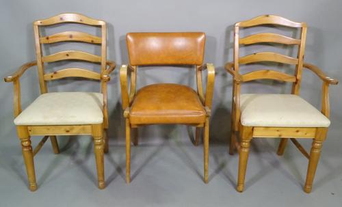 A 20th century beech bentwood open armchair with tan leather upholstery and a pair of 20th century pine ladder back open armchairs, (3). I7