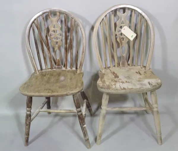 A set of eight 20th century mahogany wheelback dining chairs, (8).  G4
