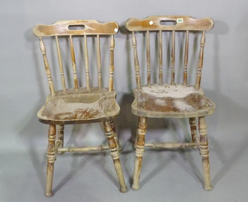 A matched set of fifteen 20th century stained pine spindle back dining chairs, (15).  S2T