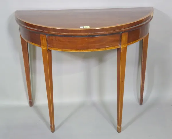 A George III mahogany and satinwood banded demi lune card table on square tapering supports, 91cm wide x 75cm high.   I4