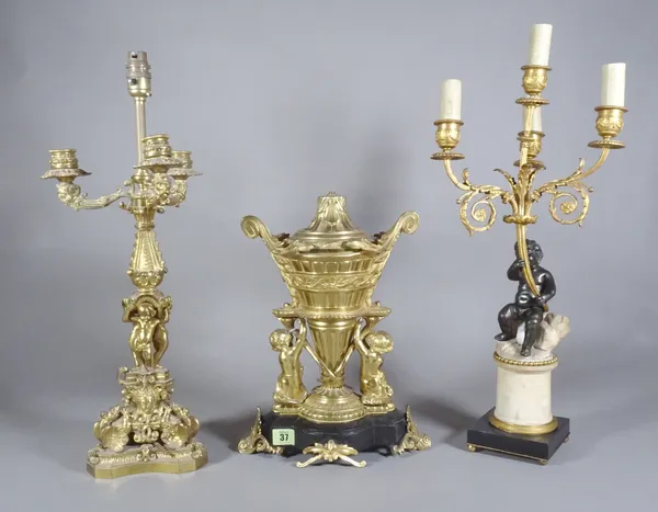 A four light bronze and ormolu candelabra, an ormolu four light candelabra and a gilt metal and marble lamp base.  S2B