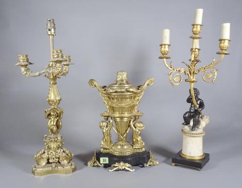 A four light bronze and ormolu candelabra, an ormolu four light candelabra and a gilt metal and marble lamp base.  S2B