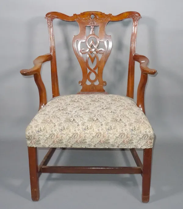 A 20th century George III style mahogany open armchair on square supports.  C8