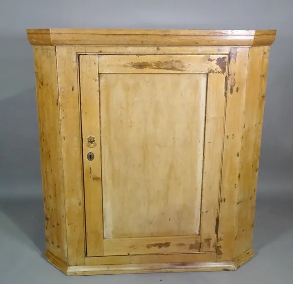 An early George III pine corner cabinet, 101cm wide x 117cm high.   G10