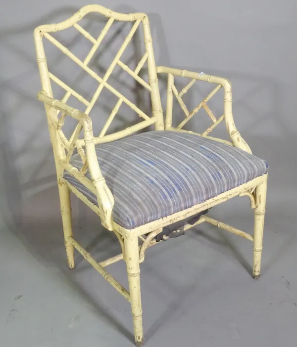 An early 20th century cream painted bamboo armchair on tapering supports.   F7
