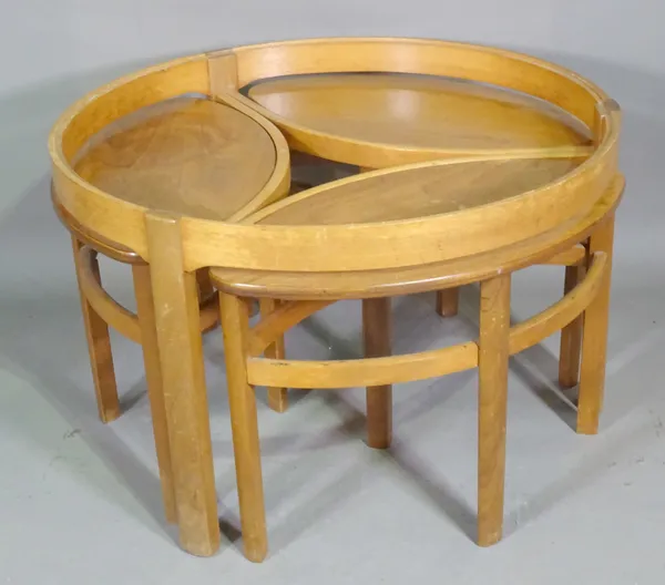A 20th century oak circular coffee table with three integral oval side tables, 82cm wide x 52cm high.  B4