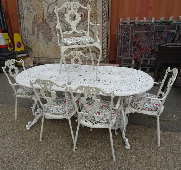 A 20th century white painted metal oval garden table 180cm wide x 70cm high and six matching chairs, (7).   OUT