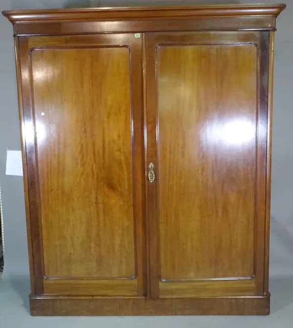 An Edwardian mahogany double wardrobe with panel doors on plinth base, 178cm wide x 208cm high.   M6
