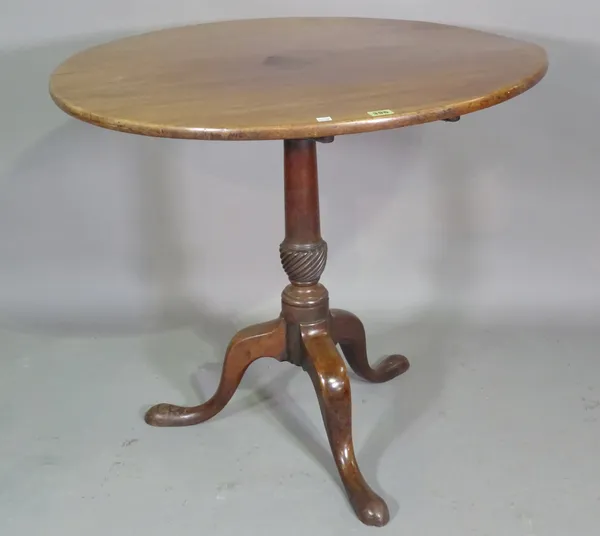 A George III mahogany circular tripod table on downswept pad supports, 78cm wide x 69cm high.  BAY 3