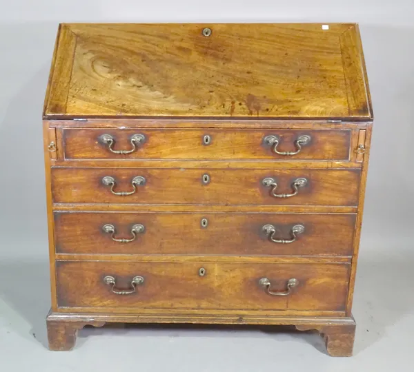 A George III mahogany bureau over four long graduated drawers on bracket feet, 99cm wide x 106cm high.   A5
