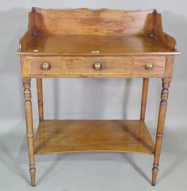 A William IV mahogany washstand with galleried top on ring turned supports, 75cm wide x 90cm high.   E10