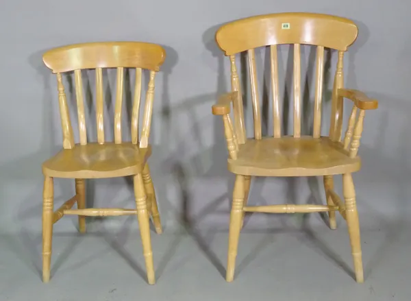A set of six 20th century beech stick back scullery chairs including a pair of carvers, (6).   F8