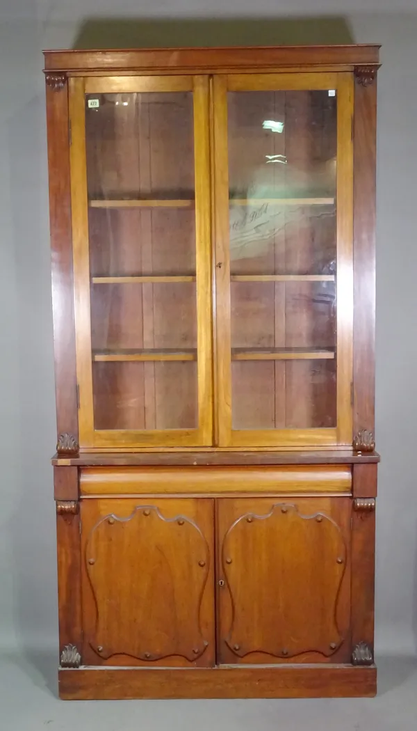 A Victorian mahogany bookcase cabinet with pair of glazed doors over cupboard base, 102cm wide x 205cm high.  M8