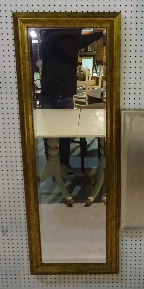 A 20th century gold painted rectangular wall mirror, 53cm wide x 140cm high and a silver painted square wall mirror, 68cm wide x 68cm high, (2).   D10