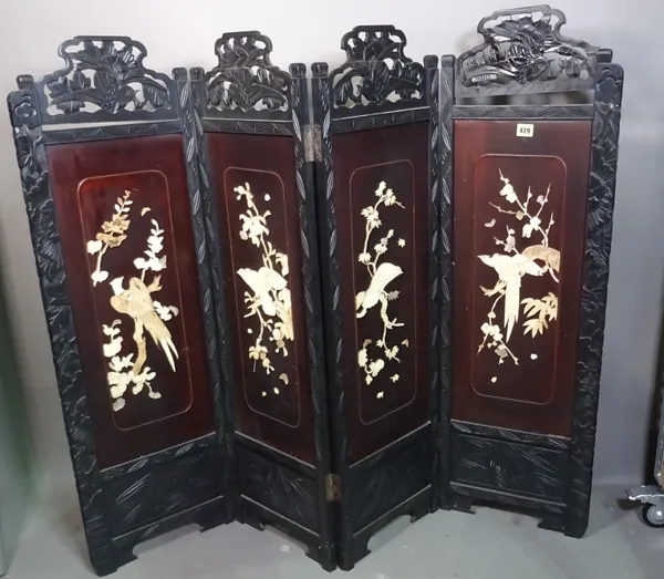 A 20th century ebonised four fold screen decorated with birds, 140cm wide x 108cm high.  J7